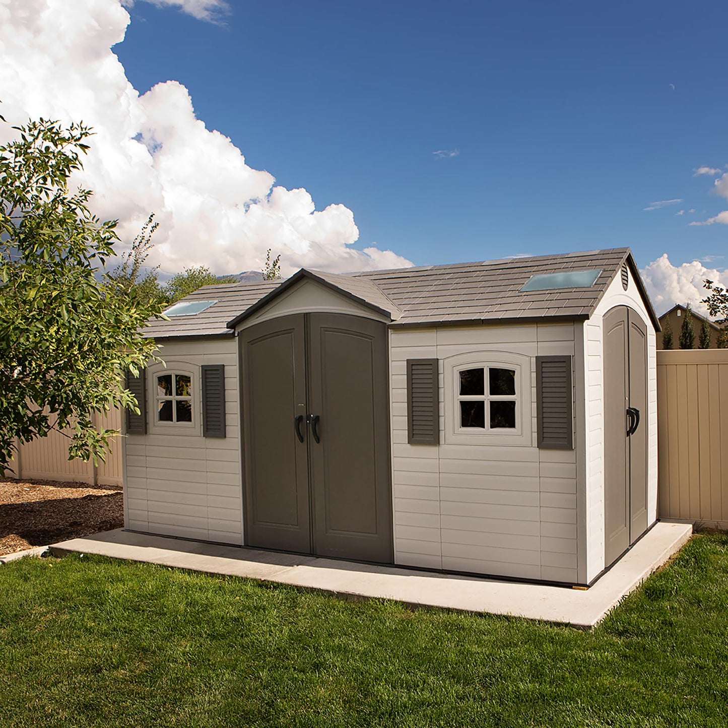 Lifetime 15×8 Ft Dual‑Entry Outdoor Storage Shed, Steel‑Reinforced, UV‑Protected, Weather‑Resistant Backyard Garden Shed with Skylights, Windows & Shelving, Desert Sand