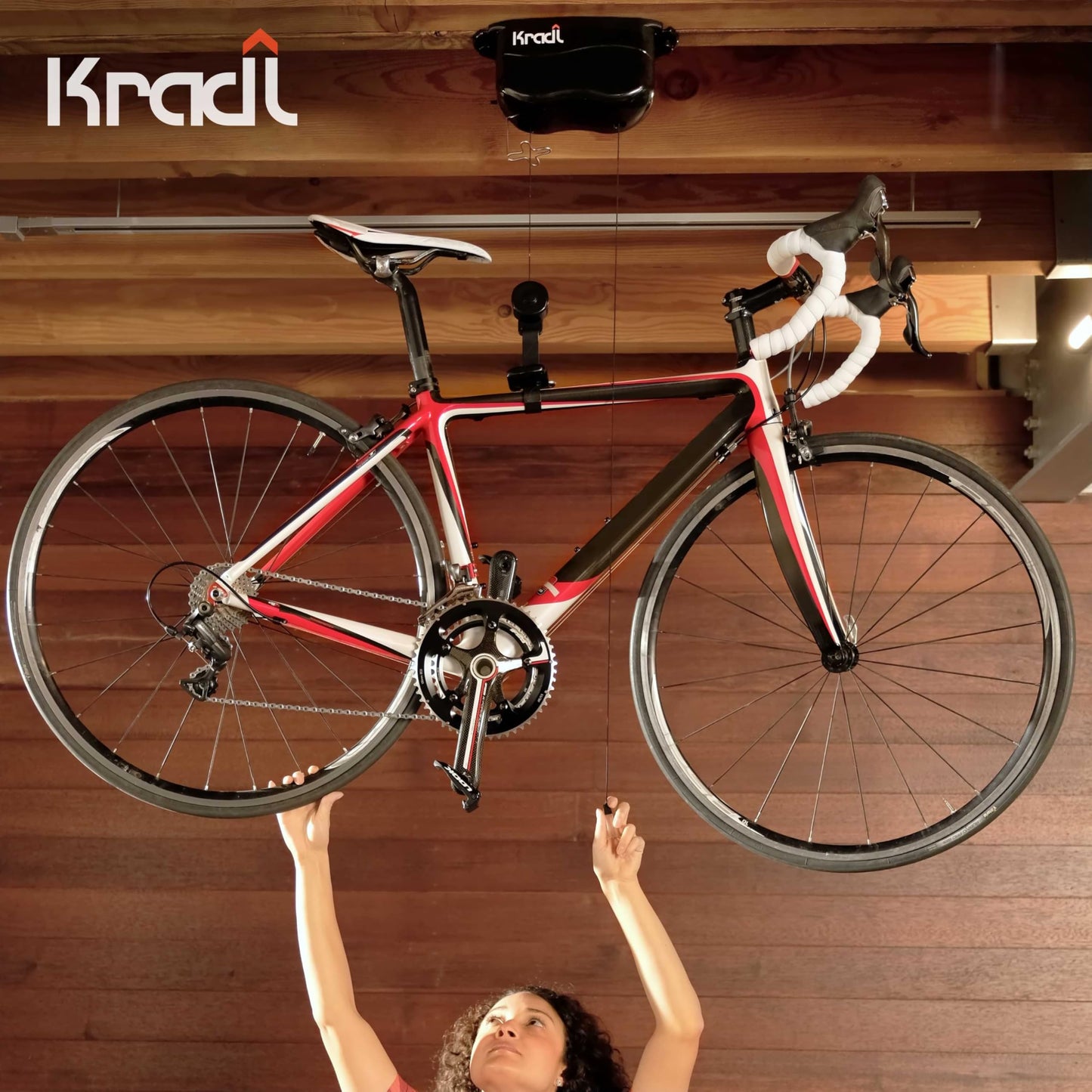 Kradl - Ceiling Mount Bike Lift and Rack. Bicycle Storage Hoist Without Electricity, Clumsy Ropes or Pulleys. 25 Pound Capacity.