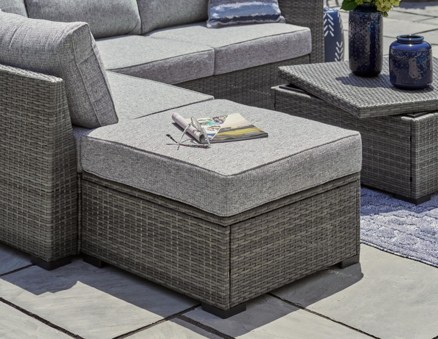 Signature Design by Ashley Petal Road Casual Nuvella Weather Resistant Fabric, Cushioned Outdoor Loveseat Sectional/Ottoman/Table Set with 2 Throw Pillows, Set of 4, Gray